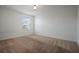 Well-lit bedroom with carpeted floor and window at 5119 11Th E St, Bradenton, FL 34203