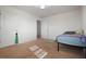 Spacious bedroom with a bed and access to another room at 5119 11Th E St, Bradenton, FL 34203