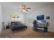 Spacious bedroom with a gaming setup and large bed at 5119 11Th E St, Bradenton, FL 34203