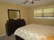 Comfortable bedroom with a queen bed and dresser at 5876 21St N St # 3, St Petersburg, FL 33714