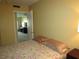 Peaceful bedroom with a queen-size bed and access to another room at 5876 21St N St # 3, St Petersburg, FL 33714