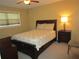 Cozy bedroom with a double bed, dresser, and nightstand at 5876 21St N St # 3, St Petersburg, FL 33714
