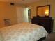Spacious bedroom with a queen bed and a view into another room at 5876 21St N St # 3, St Petersburg, FL 33714