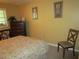 Serene bedroom with a floral comforter and dresser at 5876 21St N St # 3, St Petersburg, FL 33714