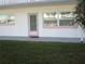 Building exterior with pink door and green lawn at 5876 21St N St # 3, St Petersburg, FL 33714