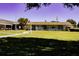 Community building with grassy yard at 5876 21St N St # 3, St Petersburg, FL 33714