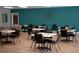 Community room with multiple tables and chairs at 5876 21St N St # 3, St Petersburg, FL 33714