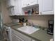 White kitchen with appliances and ample counter space at 5876 21St N St # 3, St Petersburg, FL 33714