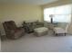 Living room with seating area and large window at 5876 21St N St # 3, St Petersburg, FL 33714