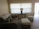 Living room with sofa, chair, and ottoman at 5876 21St N St # 3, St Petersburg, FL 33714