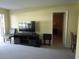 Living room with TV, entertainment center, and seating at 5876 21St N St # 3, St Petersburg, FL 33714