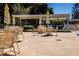 Outdoor patio area with tables, chairs, and umbrellas at 5876 21St N St # 3, St Petersburg, FL 33714