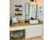 Vanity with wood countertop, vessel sink, and floating shelves at 6047 Twin Bridges Dr, Zephyrhills, FL 33541