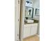 Bathroom with wood vanity, vessel sink, and modern fixtures at 6047 Twin Bridges Dr, Zephyrhills, FL 33541