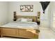 Spacious bedroom with large bed and wall art at 6047 Twin Bridges Dr, Zephyrhills, FL 33541