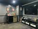 Entertain guests in this state-of-the-art home theater with a large screen TV and snack bar at 6047 Twin Bridges Dr, Zephyrhills, FL 33541