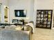 Living room with gray sectional sofa and built-in shelving at 6047 Twin Bridges Dr, Zephyrhills, FL 33541