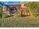 Screened patio, tropical landscaping, and home exterior at 613 Tanana Fall Dr, Ruskin, FL 33570
