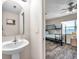 Small bathroom with pedestal sink and view to bedroom with bunk beds at 613 Tanana Fall Dr, Ruskin, FL 33570
