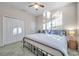 Spacious bedroom with a king-size bed and double doors leading to a large closet at 613 Tanana Fall Dr, Ruskin, FL 33570