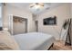 Comfortable bedroom with a queen bed, large closet, and a full-length mirror at 613 Tanana Fall Dr, Ruskin, FL 33570