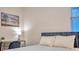 Bright bedroom featuring a desk, window and a double bed at 613 Tanana Fall Dr, Ruskin, FL 33570