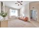 Bright bedroom with a leather couch and large window at 613 Tanana Fall Dr, Ruskin, FL 33570