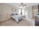 Primary bedroom with king bed and access to bathroom at 613 Tanana Fall Dr, Ruskin, FL 33570
