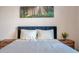 Bedroom with a blue velvet headboard and neutral bedding at 613 Tanana Fall Dr, Ruskin, FL 33570