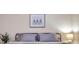 Spacious bedroom with a comfortable bed and neutral color palette at 613 Tanana Fall Dr, Ruskin, FL 33570