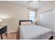 Well-lit bedroom with a full-size bed, a workspace, and ample closet space at 613 Tanana Fall Dr, Ruskin, FL 33570