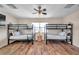 Bedroom with two bunk beds, wood flooring, and ceiling fan at 613 Tanana Fall Dr, Ruskin, FL 33570