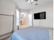 Bedroom with a queen bed and a flat-screen TV at 613 Tanana Fall Dr, Ruskin, FL 33570