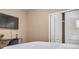 Bedroom with large TV, desk and built-in closet at 613 Tanana Fall Dr, Ruskin, FL 33570
