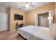 Comfortable bedroom with a full-size bed and built-in shelving at 613 Tanana Fall Dr, Ruskin, FL 33570