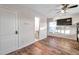 Bedroom with ensuite bathroom and a large TV at 613 Tanana Fall Dr, Ruskin, FL 33570