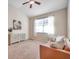 Relaxing bedroom with a large window and comfortable seating at 613 Tanana Fall Dr, Ruskin, FL 33570