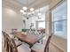 Spacious dining area with a large table and chandelier at 613 Tanana Fall Dr, Ruskin, FL 33570