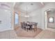 Formal dining room with a wood table and chandelier at 613 Tanana Fall Dr, Ruskin, FL 33570