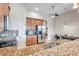 Kitchen with stainless steel appliances and granite countertops at 613 Tanana Fall Dr, Ruskin, FL 33570