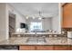 Kitchen with granite countertops and view into Gathering room at 613 Tanana Fall Dr, Ruskin, FL 33570