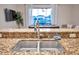 Kitchen with a granite countertop and double sink at 613 Tanana Fall Dr, Ruskin, FL 33570