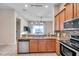 Kitchen with stainless steel appliances and granite countertops at 613 Tanana Fall Dr, Ruskin, FL 33570