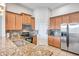 Kitchen with stainless steel appliances and granite countertops at 613 Tanana Fall Dr, Ruskin, FL 33570