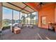 Screened porch overlooking a lake with comfortable seating at 613 Tanana Fall Dr, Ruskin, FL 33570
