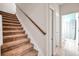 Staircase leading to upper level with bathroom access nearby at 613 Tanana Fall Dr, Ruskin, FL 33570