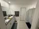 Modern bathroom with double vanity and shower at 6300 Beverly Hills Dr, Zephyrhills, FL 33541
