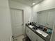 Clean bathroom with double vanity and granite countertop at 6300 Beverly Hills Dr, Zephyrhills, FL 33541