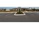 Community center exterior with parking lot and landscaping at 6300 Beverly Hills Dr, Zephyrhills, FL 33541