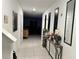 Bright entry hall with tile flooring and view to living room at 6300 Beverly Hills Dr, Zephyrhills, FL 33541